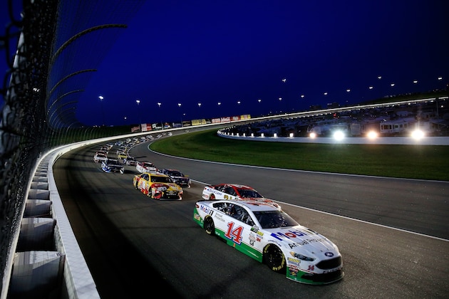 KANSAS CITY, KS - MAY 13: Clint Bowyer, driver of the #14 Mobil 1 Annual Protection Ford, leads a pack of cars during the Monster Energy NASCAR Cup Series Go Bowling 400 at Kansas Speedway on May 13, 2017 in Kansas City, Kansas.  (Photo by Chris Trotman/Getty Images)