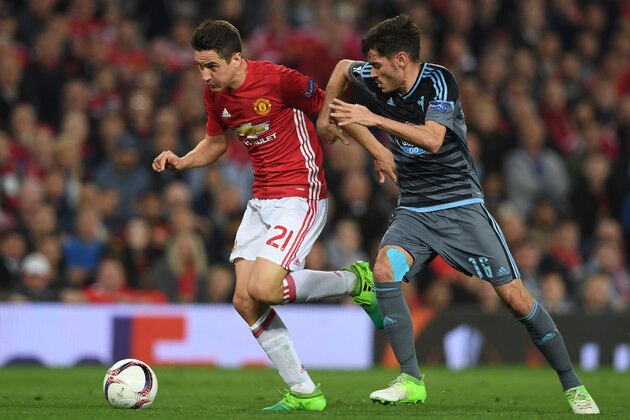 Manchester United's Spanish midfielder Ander Herrera vies with Celta Vigo's Spanish midfielder Jozabed Sanche (R) during the UEFA Europa League semi-final, second-leg football match between Manchester United and Celta Vigo at Old Trafford stadium in Manchester, north-west England, on May 11, 2017. / AFP PHOTO / Paul ELLIS        (Photo credit should read PAUL ELLIS/AFP/Getty Images)