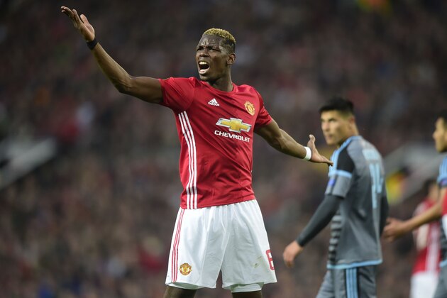 Manchester United's French midfielder Paul Pogba gestures during the UEFA Europa League semi-final, second-leg football match between Manchester United and Celta Vigo at Old Trafford stadium in Manchester, north-west England, on May 11, 2017. / AFP PHOTO / Miguel RIOPA        (Photo credit should read MIGUEL RIOPA/AFP/Getty Images)