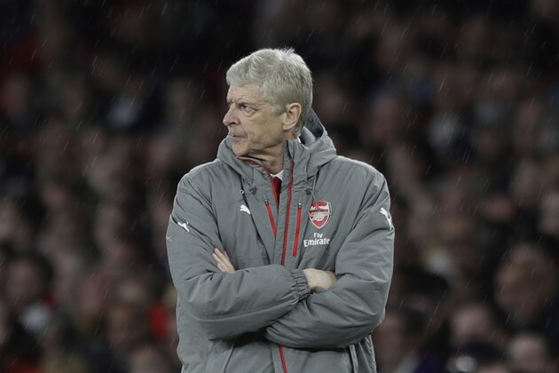 Arsenal's French manager Arsene Wenger folds his arms when the score was 0-0 during the English Premier League soccer match between Arsenal and Sunderland at the Emirates Stadium in London, Tuesday, May 16, 2017. (AP Photo/Matt Dunham)