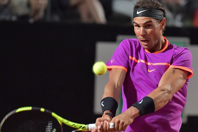 Spanish Rafael Nadal returns the ball to US Jack Sock during their third round tennis match at the ATP Tennis Open tournament on May 18, 2017 at the Foro Italico in Rome, Italy.  / AFP PHOTO / TIZIANA FABI        (Photo credit should read TIZIANA FABI/AFP/Getty Images)