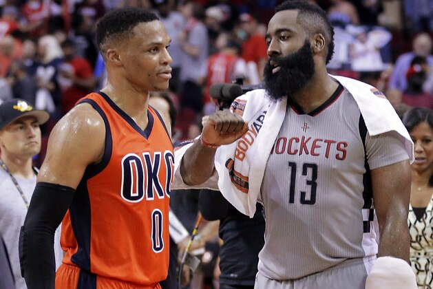 Oklahoma City Thunder's Russell Westbrook (0) and Houston Rockets' James Harden (13) talk on the court after an NBA basketball game in Houston, Sunday, March 26, 2017. (AP Photo/Michael Wyke)