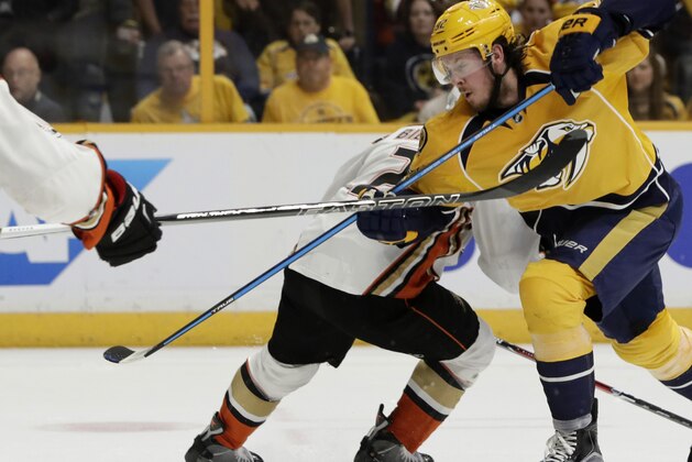 Anaheim Ducks defenseman Kevin Bieksa (2) battles against Nashville Predators center Ryan Johansen,foreground, in the second period of Game 4 of the Western Conference final in the NHL hockey Stanley Cup playoffs Thursday, May 18, 2017, in Nashville, Tenn. (AP Photo/Mark Humphrey)