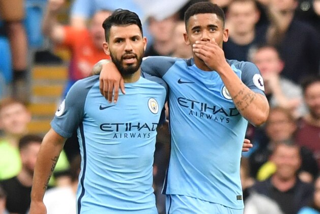 Manchester City's Brazilian striker Gabriel Jesus (R) walks with Manchester City's Argentinian striker Sergio Aguero (L) as he celebrates scoring the opening goal during the English Premier League football match between Manchester City and West Bromwich Albion at the Etihad Stadium in Manchester, north west England, on May 16, 2017. / AFP PHOTO / Anthony Devlin / RESTRICTED TO EDITORIAL USE. No use with unauthorized audio, video, data, fixture lists, club/league logos or 'live' services. Online in-match use limited to 75 images, no video emulation. No use in betting, games or single club/league/player publications.  /         (Photo credit should read ANTHONY DEVLIN/AFP/Getty Images)