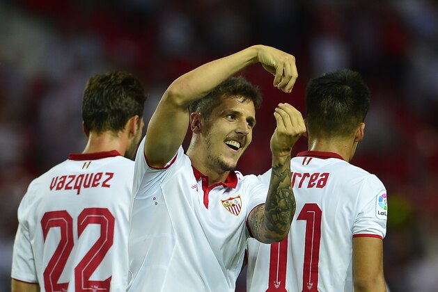 Sevilla's Montenegrin forward Stevan Jovetic (C) celebrates after scoring a goal during the Spanish league football match Sevilla FC vs CA Osasuna at the Ramon Sanchez Pizjuan stadium in Sevilla on May 20, 2017. / AFP PHOTO / CRISTINA QUICLER        (Photo credit should read CRISTINA QUICLER/AFP/Getty Images)