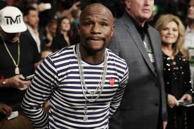 Retired boxer and boxing promoter Floyd Mayweather Jr. attends a fight between Carl Frampton, of Northern Ireland, and Leo Santa Cruz, Saturday, Jan. 28, 2017, in Las Vegas. Mayweather. says facing UFC star Conor McGregor in a boxing ring
