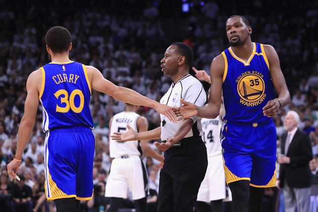 SAN ANTONIO, TX - MAY 20:  Stephen Curry #30 high fives Kevin Durant #35 of the Golden State Warriors in the first half against the San Antonio Spurs during Game Three of the 2017 NBA Western Conference Finals at AT&T Center on May 20, 2017 in San Antonio, Texas. NOTE TO USER: User expressly acknowledges and agrees that, by downloading and or using this photograph, User is consenting to the terms and conditions of the Getty Images License Agreement.  (Photo by Ronald Martinez/Getty Images)
