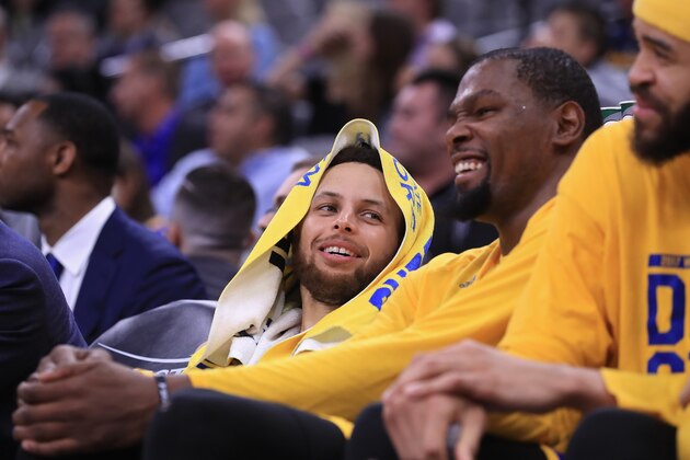 SAN ANTONIO, TX - MAY 20:  Stephen Curry #30 and Kevin Durant #35 of the Golden State Warriors react on the bench during the fourth quarter against the San Antonio Spurs during Game Three of the 2017 NBA Western Conference Finals at AT&T Center on May 20, 2017 in San Antonio, Texas. NOTE TO USER: User expressly acknowledges and agrees that, by downloading and or using this photograph, User is consenting to the terms and conditions of the Getty Images License Agreement.  (Photo by Ronald Martinez/Getty Images)