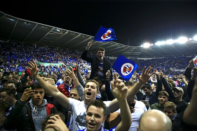 READING, ENGLAND - MAY 16:  Reading fans celebrate on the pitch following the Sky Bet Championship Play Off Second Leg match between Reading and Fulham at Madejski Stadium on May 16, 2017 in Reading, England.  (Photo by Ben Hoskins/Getty Images)