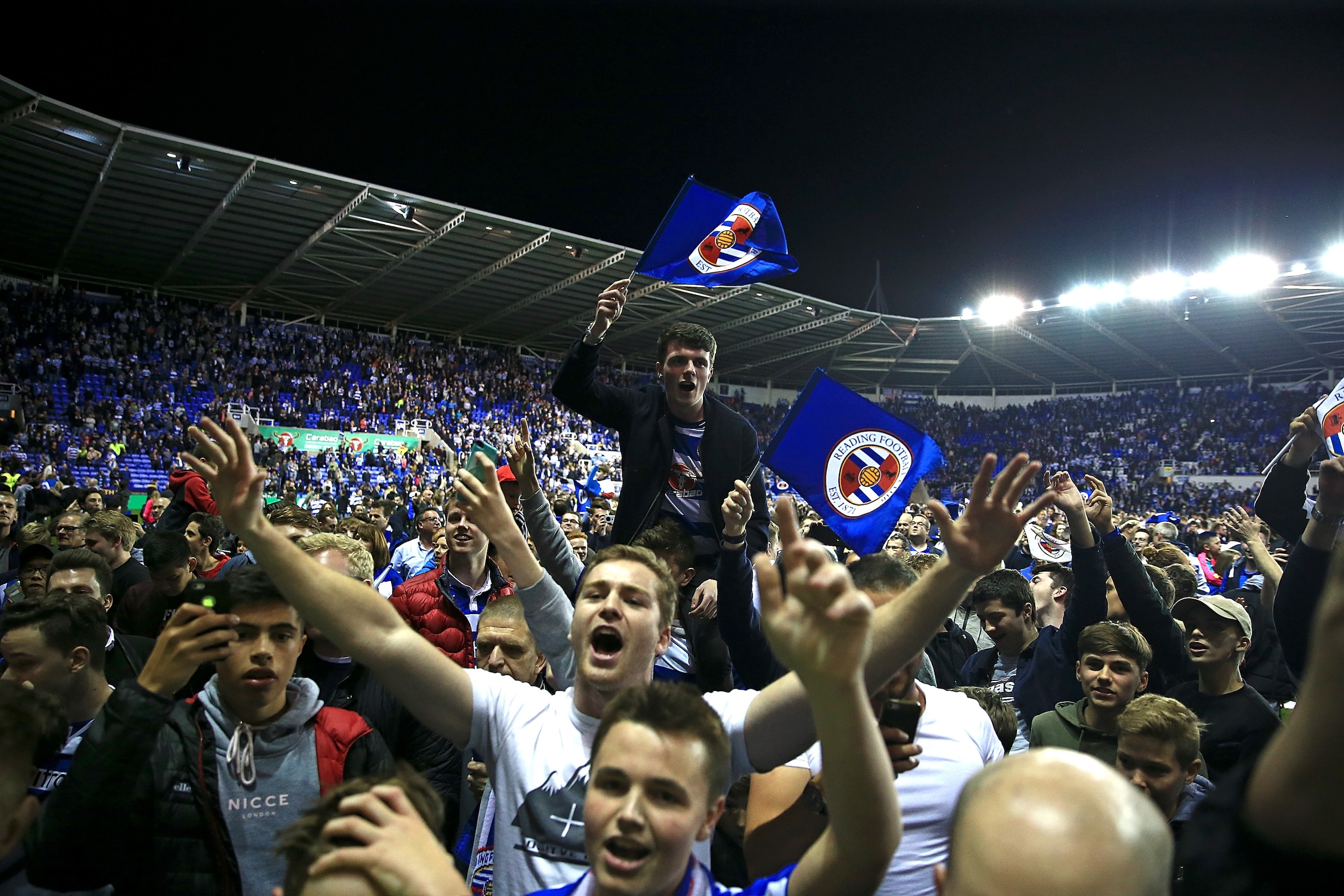 READING, ENGLAND - MAY 16:  Reading fans celebrate on the pitch following the Sky Bet Championship Play Off Second Leg match between Reading and Fulham at Madejski Stadium on May 16, 2017 in Reading, England.  (Photo by Ben Hoskins/Getty Images)