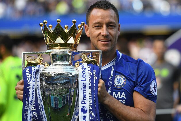 LONDON, ENGLAND - MAY 21:  John Terry of Chelsea poses with the Premier League Trophy after the Premier League match between Chelsea and Sunderland at Stamford Bridge on May 21, 2017 in London, England.  (Photo by Shaun Botterill/Getty Images)