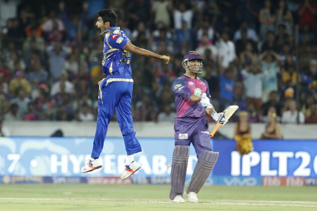 Mumbai Indians' Jasprit Bumra, left, celebrates the dismissal of Rising Pune Supergiant's Mahendra Singh Dhoni during their Indian Premier League (IPL) cricket final match in Hyderabad, India, Sunday, May 21, 2017. (AP Photo/Tsering Topgyal)