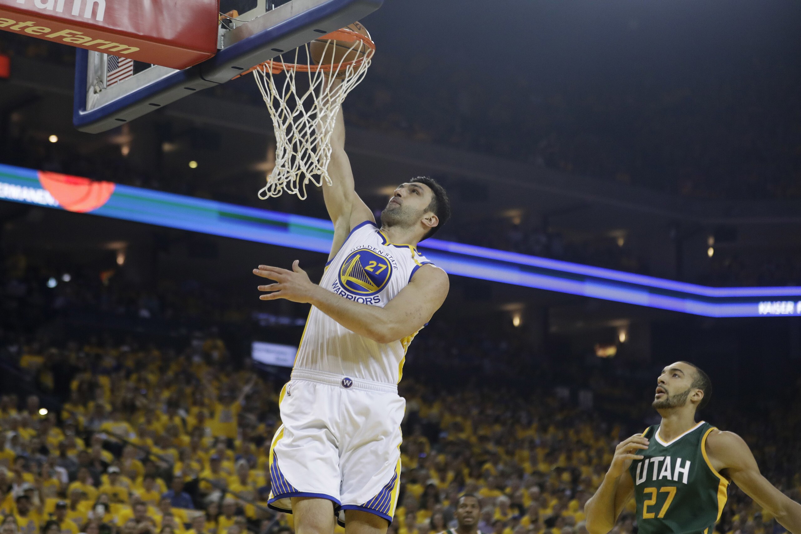 Golden State Warriors' Zaza Pachulia (27) dunks past Utah Jazz's Rudy Gobert (27) during the first half in Game 1 of an NBA basketball second-round playoff series, Tuesday, May 2, 2017, in Oakland, Calif. (AP Photo/Marcio Jose Sanchez)