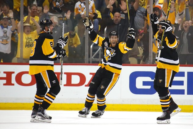 PITTSBURGH, PA - MAY 21:  Nick Bonino #13 of the Pittsburgh Penguins celebrates with teammates Brian Dumoulin #8 and Carter Rowney #37 after Bryan Rust #17 (not pictured) scored a goal against Craig Anderson #41 (not pictured) of the Ottawa Senators during the first period in Game Five of the Eastern Conference Final during the 2017 NHL Stanley Cup Playoffs at PPG PAINTS Arena on May 21, 2017 in Pittsburgh, Pennsylvania.  (Photo by Gregory Shamus/Getty Images)