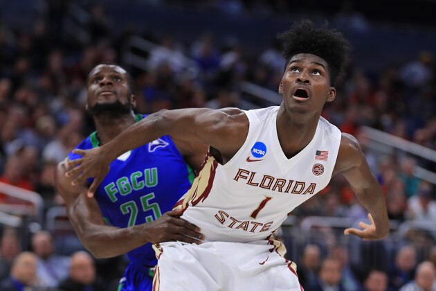 ORLANDO, FL - MARCH 16:  Marc-Eddy Norelia #25 of the Florida Gulf Coast Eagles and Jonathan Isaac #1 of the Florida State Seminoles battle for position during a free throw in the first half during the first round of the 2017 NCAA Men's Basketball Tournament at Amway Center on March 16, 2017 in Orlando, Florida.  (Photo by Mike Ehrmann/Getty Images)