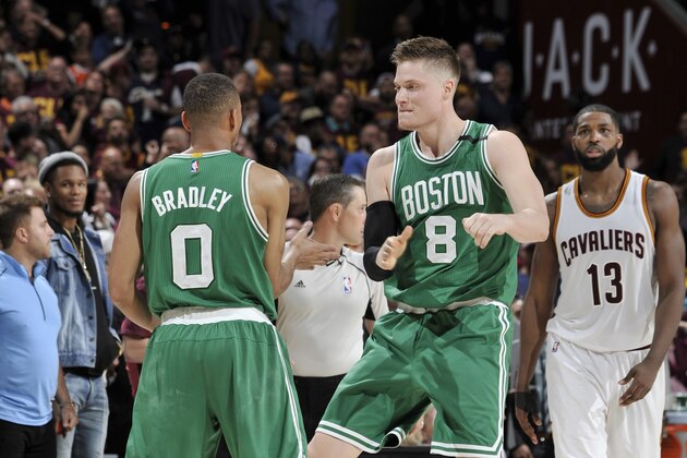 CLEVELAND, OH - MAY 21:  Avery Bradley #0 and Jonas Jerebko #8 of the Boston Celtics celebrate during Game Three of the Eastern Conference Finals of the 2017 NBA Playoffs on May 21, 2017 at Quicken Loans Arena in Cleveland, Ohio. NOTE TO USER: User expressly acknowledges and agrees that, by downloading and/or using this photograph, user is consenting to the terms and conditions of the Getty Images License Agreement. Mandatory Copyright Notice: Copyright 2017 NBAE (Photo by David Liam Kyle/NBAE via Getty Images)