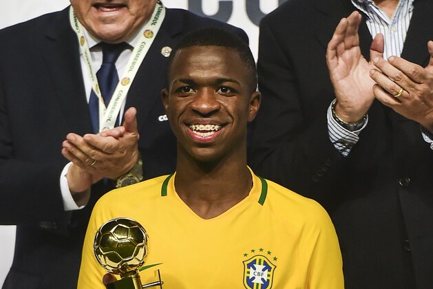 Brazil´s  Vinicius Junior poses with the best player trophy in the South American U-17 football tournament in Rancagua, some 90 km south of Santiago de Chile on March 19, 2017. / AFP PHOTO / MARTIN BERNETTI        (Photo credit should read MARTIN BERNETTI/AFP/Getty Images)