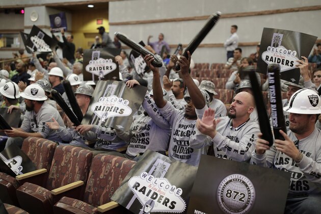 Laborers union members cheer during a meeting of the Las Vegas Stadium Authority board, Thursday, May 18, 2017, in Las Vegas. The public entity that oversees the proposed stadium where the Raiders want to start playing in 2020 has approved a conditional lease agreement for the facility. (AP Photo/John Locher)