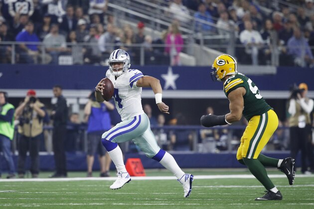 ARLINGTON, TX - JANUARY 15: Dak Prescott #4 of the Dallas Cowboys runs with the ball during the NFC Divisional Playoff game against the Green Bay Packers at AT&T Stadium on January 15, 2017 in Arlington, Texas. The Packers defeated the Cowboys 34-31. (Photo by Joe Robbins/Getty Images)