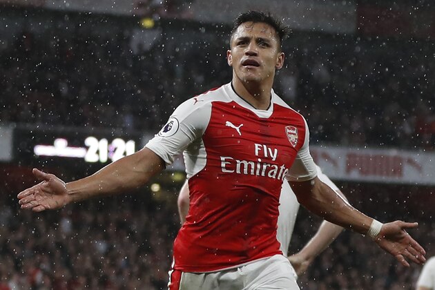 Arsenal's Chilean striker Alexis Sanchez celebrates scoring the second goal during the English Premier League football match between Arsenal and Sunderland at the Emirates Stadium in London on May 16, 2017.  / AFP PHOTO / Adrian DENNIS / RESTRICTED TO EDITORIAL USE. No use with unauthorized audio, video, data, fixture lists, club/league logos or 'live' services. Online in-match use limited to 75 images, no video emulation. No use in betting, games or single club/league/player publications.  /         (Photo credit should read ADRIAN DENNIS/AFP/Getty Images)