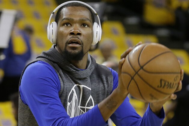 Golden State Warriors forward Kevin Durant warms up Game 1 of the NBA basketball Western Conference finals between the Warriors and the San Antonio Spurs in Oakland, Calif., Sunday, May 14, 2017. (AP Photo/Jeff Chiu)