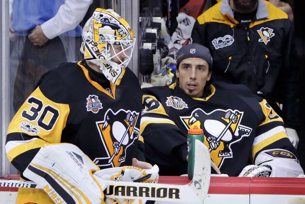 Pittsburgh Penguins goalie Matt Murray (30) talks with goalie Marc-Andre Fleury in a break during the third period against the Ottawa Senators in Game 5 of the NHL hockey Stanley Cup Eastern Conference finals, Sunday, May 21, 2017, in Pittsburgh. The Penguins won 7-0.(AP Photo/Gene J.Puskar)