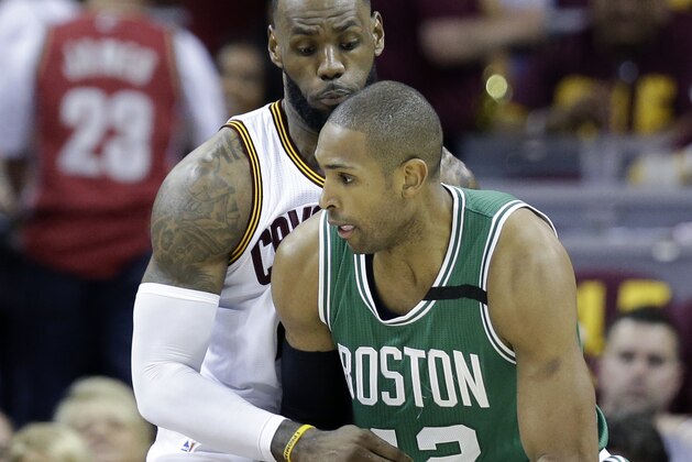 Cleveland Cavaliers' LeBron James (23) defends against Boston Celtics' Al Horford (42), from Dominican Republic, during the second half of Game 3 of the NBA basketball Eastern Conference finals, Sunday, May 21, 2017, in Cleveland. (AP Photo/Tony Dejak)