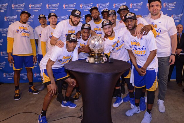 SAN ANTONIO, TX - MAY 22:  The Golden State Warriors pose for a photo with the Western Conference Championship Trophy after winning Game Four of the Western Conference Finals against the San Antonio Spurs during the 2017 NBA Playoffs on May 22, 2017 AT&T Center in San Antonio, Texas. NOTE TO USER: User expressly acknowledges and agrees that, by downloading and or using this photograph, user is consenting to the terms and conditions of the Getty Images License Agreement. Mandatory Copyright Notice: Copyright 2017 NBAE (Photos by Noah Graham /NBAE via Getty Images)