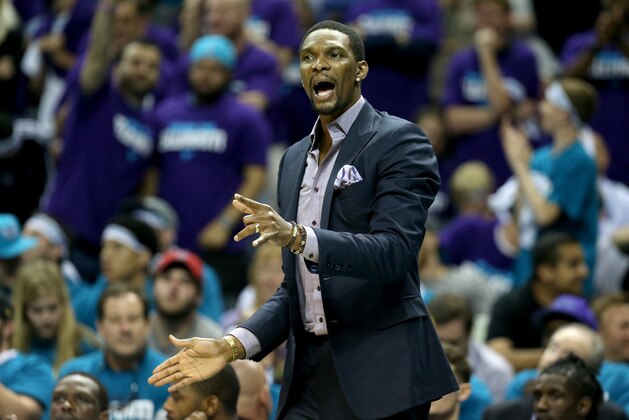 CHARLOTTE, NC - APRIL 25:  Chris Bosh #1 of the Miami Heat watches on from the bench against the Charlotte Hornets during game four of the Eastern Conference Quarterfinals of the 2016 NBA Playoffs at Time Warner Cable Arena on April 25, 2016 in Charlotte, North Carolina.  NOTE TO USER: User expressly acknowledges and agrees that, by downloading and or using this photograph, User is consenting to the terms and conditions of the Getty Images License Agreement.  (Photo by Streeter Lecka/Getty Images)