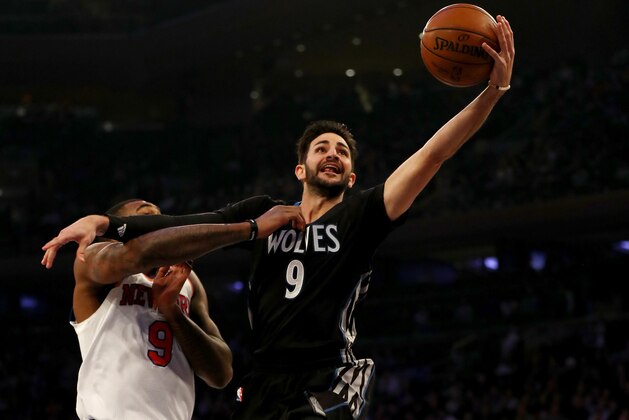 NEW YORK, NY - DECEMBER 02:  Ricky Rubio #9 of the Minnesota Timberwolves heads for the net as Kyle O'Quinn #9 of the New York Knicks defends at Madison Square Garden on December 2, 2016 in New York City. NOTE TO USER: User expressly acknowledges and agrees that, by downloading and or using this Photograph, user is consenting to the terms and conditions of the Getty Images License Agreement  (Photo by Elsa/Getty Images)
