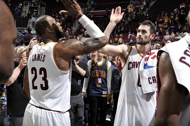 CLEVELAND, OH - MAY 23: LeBron James #23 and Kevin Love #0 of the Cleveland Cavaliers high five each other after the game against the Boston Celtics in Game Four of the Eastern Conference Finals of the 2017 NBA Playoffs on May 23, 2017 at The Quicken Loans Arena in Cleveland, Ohio. NOTE TO USER: User expressly acknowledges and agrees that, by downloading and/or using this Photograph, user is consenting to the terms and conditions of the Getty Images License Agreement. Mandatory Copyright Notice: Copyright 2017 NBAE (Photo by David Liam Kyle/NBAE via Getty Images)