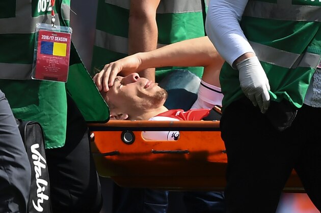 Arsenal's Brazilian defender Gabriel is stretchered off injured during the English Premier League football match between Arsenal and Everton at the Emirates Stadium in London on May 21, 2017.  / AFP PHOTO / Justin TALLIS / RESTRICTED TO EDITORIAL USE. No use with unauthorized audio, video, data, fixture lists, club/league logos or 'live' services. Online in-match use limited to 75 images, no video emulation. No use in betting, games or single club/league/player publications.  /         (Photo credit should read JUSTIN TALLIS/AFP/Getty Images)