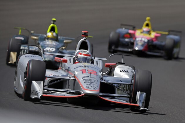 Will Power, of Australia, leads a packs of car through the first turn during practice for the Indianapolis 500 IndyCar auto race at Indianapolis Motor Speedway, Monday, May 22, 2017, in Indianapolis. (AP Photo/Michael Conroy)