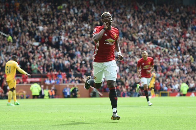 Manchester United's French midfielder Paul Pogba celebrates scoring their second goal during the English Premier League football match between Manchester United and Cyrstal Palace at Old Trafford in Manchester, north west England, on May 21, 2017. / AFP PHOTO / Oli SCARFF / RESTRICTED TO EDITORIAL USE. No use with unauthorized audio, video, data, fixture lists, club/league logos or 'live' services. Online in-match use limited to 75 images, no video emulation. No use in betting, games or single club/league/player publications.  /         (Photo credit should read OLI SCARFF/AFP/Getty Images)