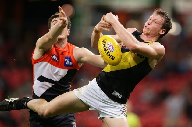 SYDNEY, AUSTRALIA - MAY 20:  Dylan Grimes of the Tigers is challenged by Jeremy Cameron of the Giants during the round nine AFL match between the Greater Western Sydney Giants and the Richmond Tigers at Spotless Stadium on May 20, 2017 in Sydney, Australia.  (Photo by Matt King/AFL Media/Getty Images)