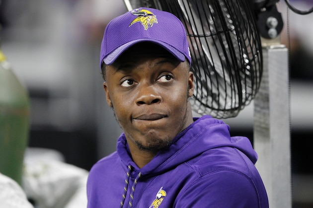 Injured Minnesota Vikings quarterback Teddy Bridgewater sits on the bench before an NFL football game against Dallas Cowboys Thursday, Dec. 1, 2016, in Minneapolis. (AP Photo/Andy Clayton-King)