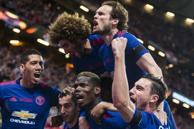 STOCKHOLM, SWEDEN - MAY 24: Henrikh Mkhitaryan, Chris Smalling, Matteo Darmian, Juan Mata, and Paul Pogba of Manchester United celebrate scoring the 0-2 goal during the UEFA Europa League final between Ajax and Manchester United at Friends Arena on May 24, 2017 in Stockholm, Sweden. (Photo by MICHAEL CAMPANELLA/Getty Images)