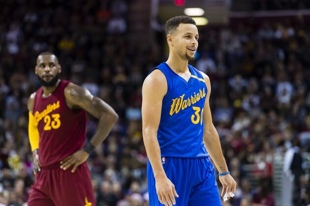 CLEVELAND, OH - DECEMBER 25: LeBron James #23 of the Cleveland Cavaliers and Stephen Curry #30 of the Golden State Warriors pause on the court during the first half at Quicken Loans Arena on December 25, 2016 in Cleveland, Ohio. NOTE TO USER: User expressly acknowledges and agrees that, by downloading and/or using this photograph, user is consenting to the terms and conditions of the Getty Images License Agreement. Mandatory copyright notice. (Photo by Jason Miller/Getty Images)
