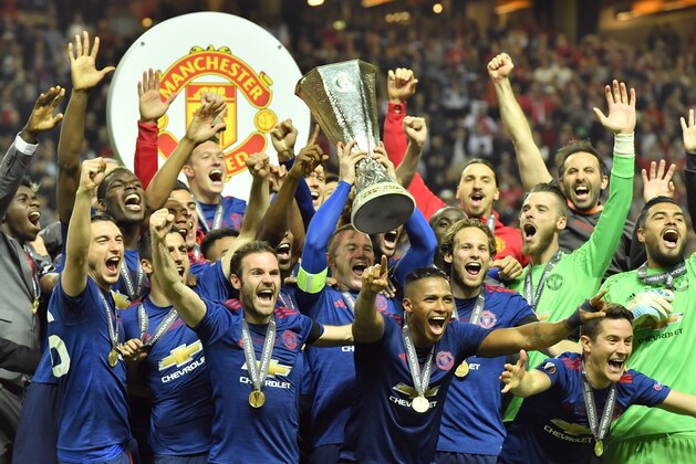 United's Wayne Rooney, center, lifts the trophy after winning the soccer Europa League final between Ajax Amsterdam and Manchester United at the Friends Arena in Stockholm, Sweden, Wednesday, May 24, 2017. United won 2-0. (AP Photo/Martin Meissner)