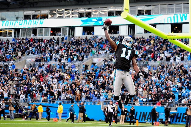 CHARLOTTE, NC - NOVEMBER 18:  Brandon LaFell #11 of the Carolina Panthers dunks the football over the crossbar after scoring a toucdown against the Tampa Bay Buccaneers during play at Bank of America Stadium on November 18, 2012 in Charlotte, North Carolina. Tampa Bay won 27-21 in overtime.  (Photo by Grant Halverson/Getty Images)