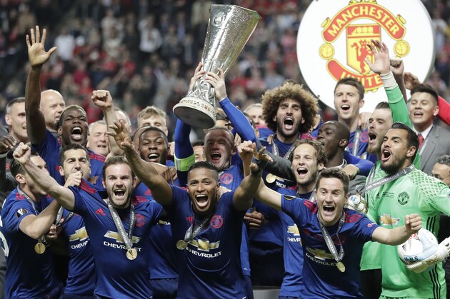 Manchester's Wayne Rooney lifts the trophy after winning 2-0 in the soccer Europa League final between Ajax Amsterdam and Manchester United at the Friends Arena in Stockholm, Sweden, Wednesday, May 24, 2017. (AP Photo/Michael Sohn)