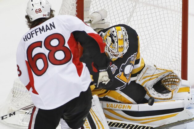 Pittsburgh Penguins' Matt Murray, right, makes a save on Ottawa Senators' Mike Hoffman (68) during the third period of Game 5 in the NHL hockey Stanley Cup Eastern Conference finals, Sunday, May 21, 2017, in Pittsburgh. The Penguins won 7-0. (AP Photo/Gene J.Puskar)