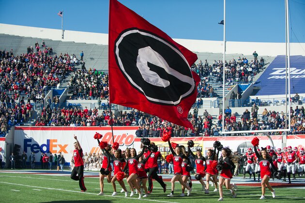 MEMPHIS, TN - DECEMBER 30: Cheerleaders with the Georgia Bulldogs run out onto the field prior to their game against the TCU Horned Frogs at Liberty Bowl Memorial Stadium on December 30, 2016 in Memphis, Tennessee. The Georgia Bulldogs defeated the TCU Horned Frogs 31-23. (Photo by Michael Chang/Getty Images) *** Local Caption ***