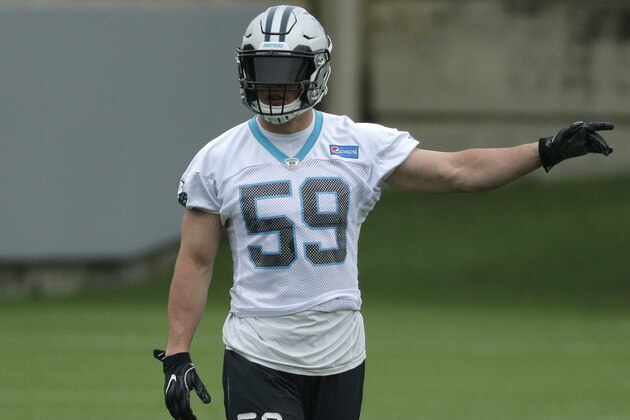 Carolina Panthers' Luke Kuechly (59) directs the defense during the NFL football team's organized team activity in Charlotte, N.C., Thursday, May 25, 2017. (AP Photo/Chuck Burton)