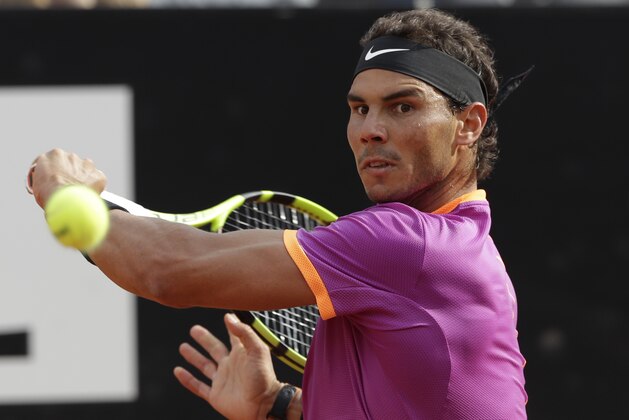 Rafael Nadal of Spain returns the ball to Dominic Thiem of Austria during their match at the Italian Open tennis tournament, in Rome, Friday, May 19, 2017. Thiem beat Nadal 6-4, 6-3. (AP Photo/Alessandra Tarantino)