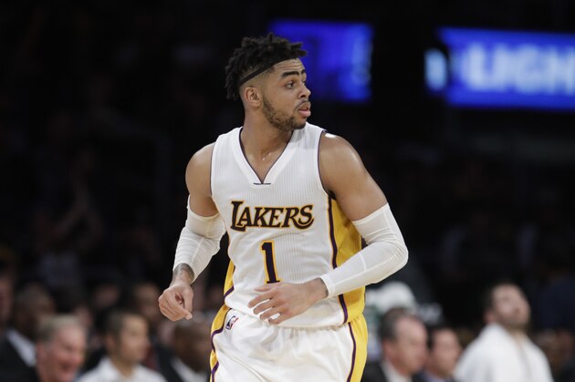 Los Angeles Lakers' D'Angelo Russell makes his way down the court during the second half of an NBA basketball game against the Cleveland Cavaliers Sunday, March 19, 2017, in Los Angeles. (AP Photo/Jae C. Hong)