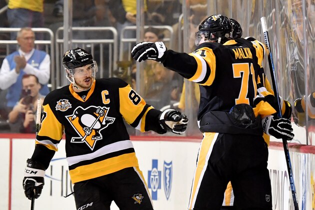 PITTSBURGH, PA - MAY 25:  Justin Schultz #4 of the Pittsburgh Penguins celebrates with his teammates Sidney Crosby #87 and Evgeni Malkin #71 after scoring a goal against Craig Anderson #41 of the Ottawa Senators during the third period in Game Seven of the Eastern Conference Final during the 2017 NHL Stanley Cup Playoffs at PPG PAINTS Arena on May 25, 2017 in Pittsburgh, Pennsylvania.  (Photo by Jamie Sabau/Getty Images)