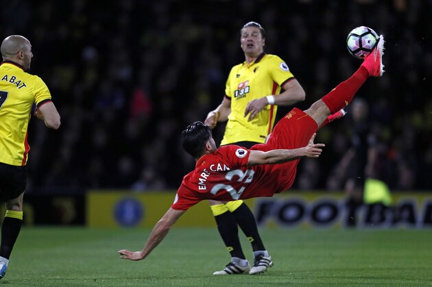 Liverpool's German midfielder Emre Can connects with this overhead kick to open the scoring in the English Premier League football match between Watford and Liverpool at Vicarage Road Stadium in Watford, north of London on May 1, 2017. / AFP PHOTO / Adrian DENNIS / RESTRICTED TO EDITORIAL USE. No use with unauthorized audio, video, data, fixture lists, club/league logos or 'live' services. Online in-match use limited to 75 images, no video emulation. No use in betting, games or single club/league/player publications.  /         (Photo credit should read ADRIAN DENNIS/AFP/Getty Images)