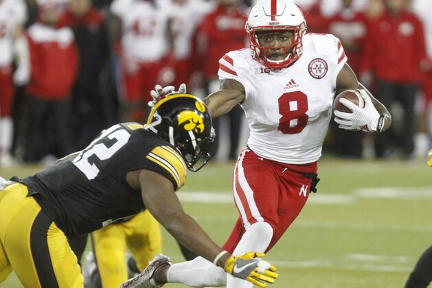 IOWA CITY, IA- NOVEMBER 25:  Wide receiver Stanley Morgan Jr. #8 of the Nebraska Cornhuskers runs in front of defensive back Anthony Gair #12 of the Iowa Hawkeyes, during the third quarter on November 25, 2016 at Kinnick Stadium in Iowa City, Iowa.  (Photo by Matthew Holst/Getty Images)