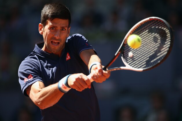 MADRID, SPAIN - MAY 13:  Novak Djokovic of Serbia in action against Rafael Nadal of Spain in the semi finals during day eight of the Mutua Madrid Open tennis at La Caja Magica on May 13, 2017 in Madrid, Spain.  (Photo by Julian Finney/Getty Images)